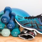 tennis shoes, dumbbell, and ankle weights
