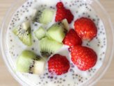 strawberries and kiwi in a bowl with dairy