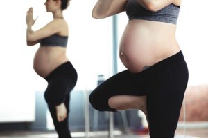 pregnant lady doing yoga